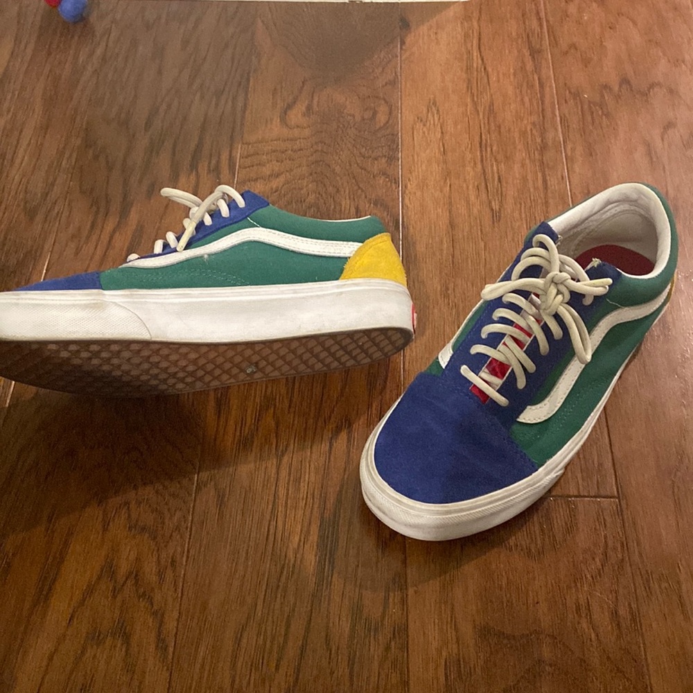 Blue, Green, Yellow, and Red coloured Vans